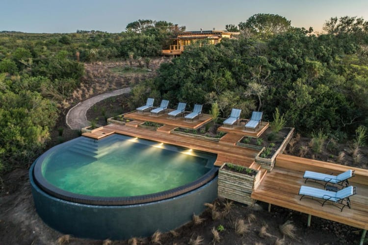 Iconic rim flow pool with part of lodge in background